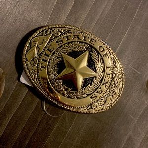 Small gold Texas belt buckle.